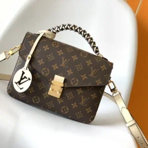 Louis Vuitton Pochette Metis crossbody bag front view in Monogram coated canvas with structured silhouette and gold-tone S-lock closure