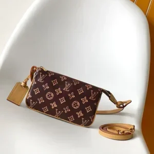 LV Pochette Accessoires monogram canvas pouch with fox print detail held in white gloves, compact luxury Louis Vuitton accessory pouch.