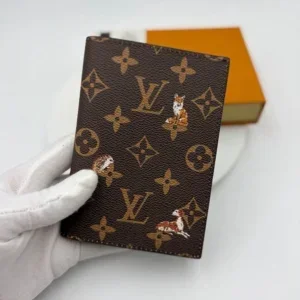 Louis Vuitton Monogram passport cover with embroidered fox and dog