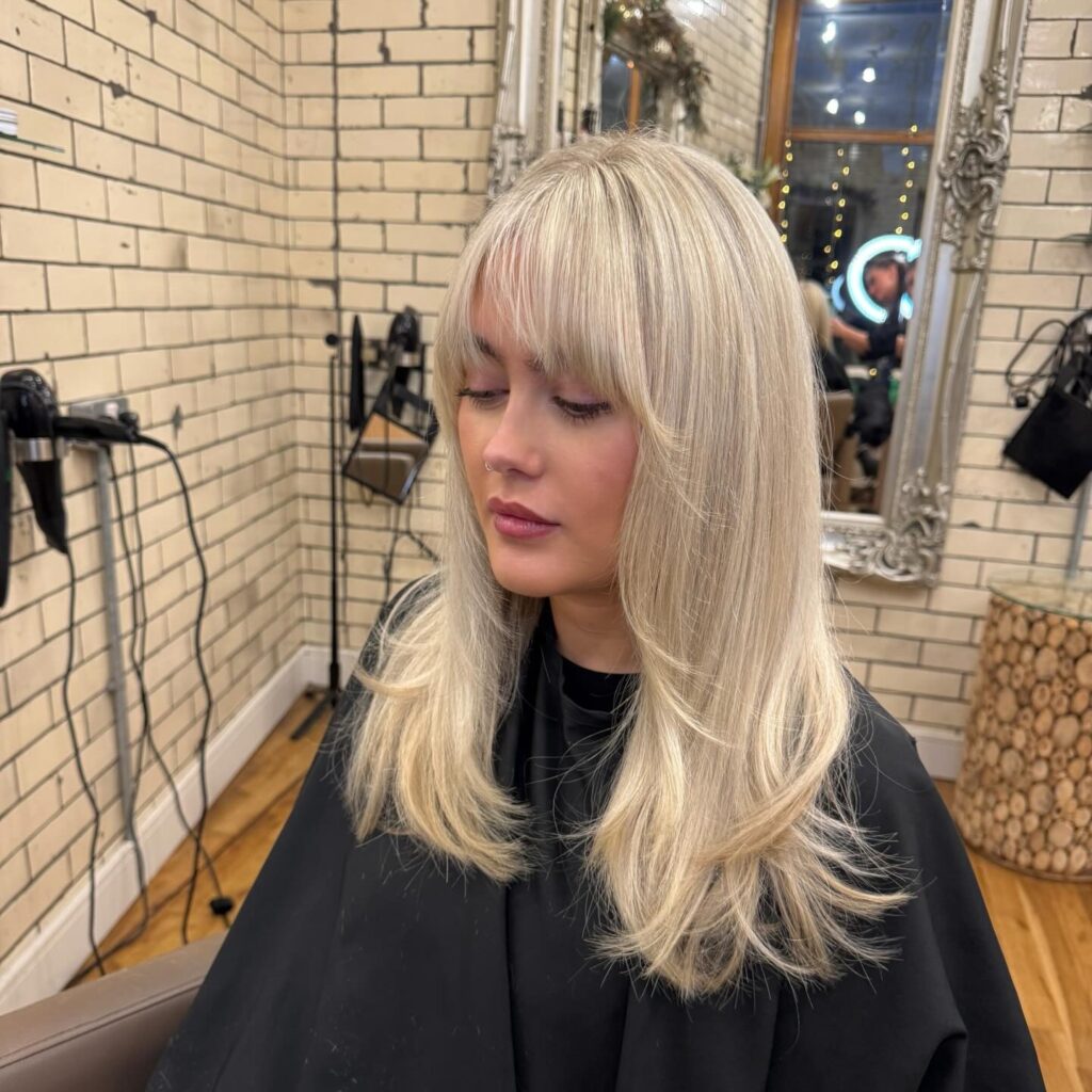 Icy Platinum Bangs With Soft Layered Ends